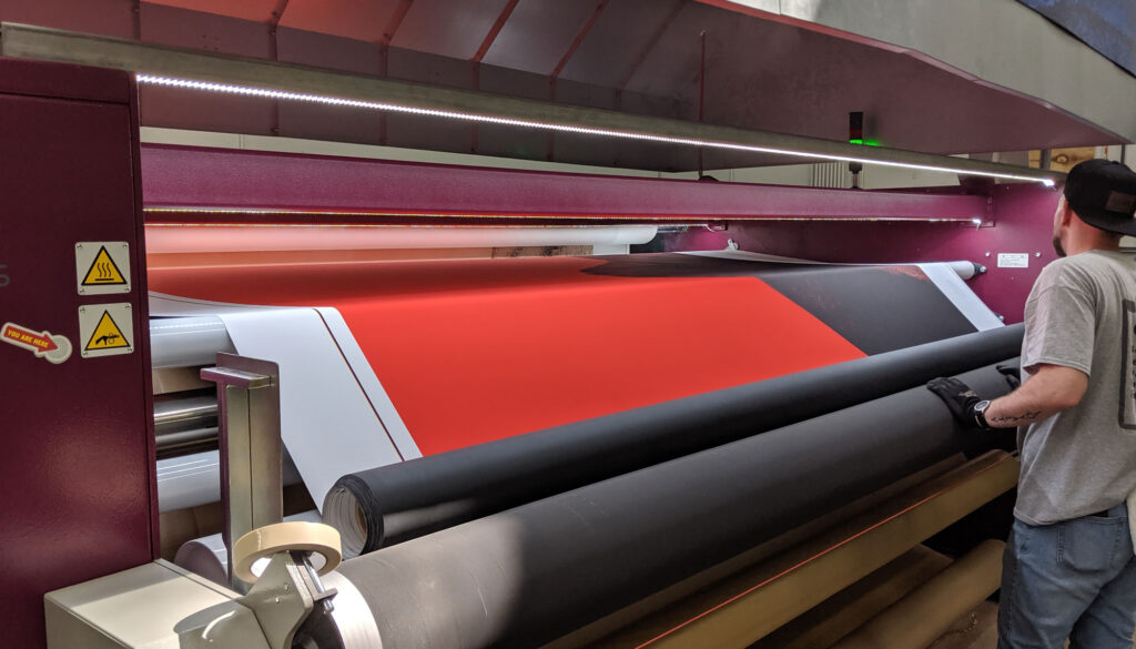 custom printing - large format printers with someone working at them