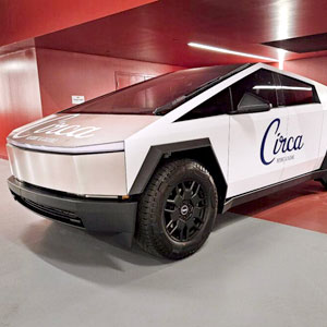 A Cybertruck with a vehicle wrap.