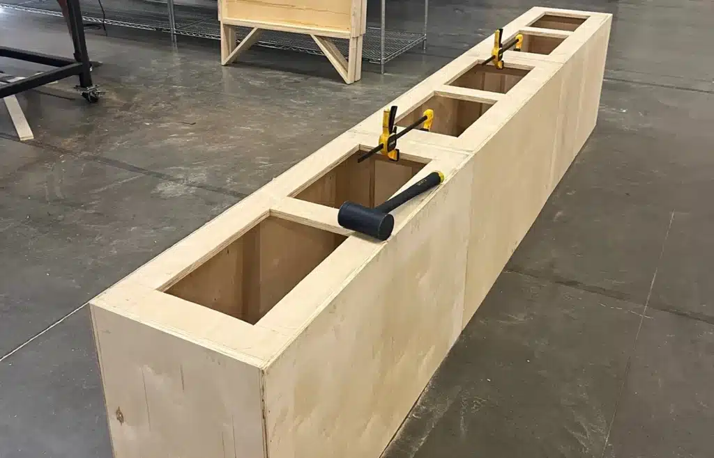 A large, wooden frame with tools to make up the base of a graphic