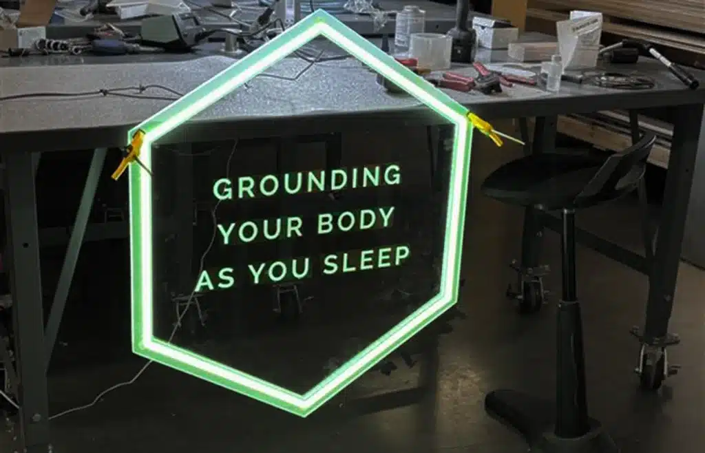 A hexagonal stand-off acrylic piece with RGB LED lighting.