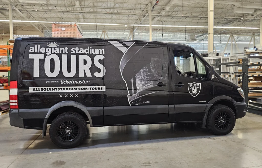 A custom van for the Las Vegas Raiders wrapped in vinyl.